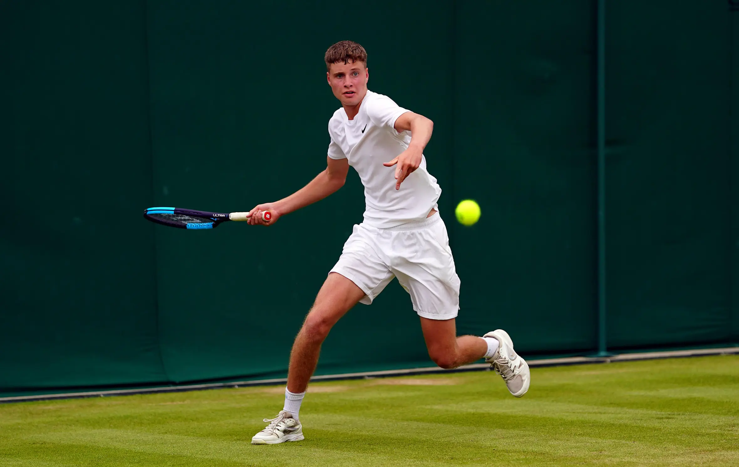 Toby Samuel is in action during the Wimbledon Boys' Championship.