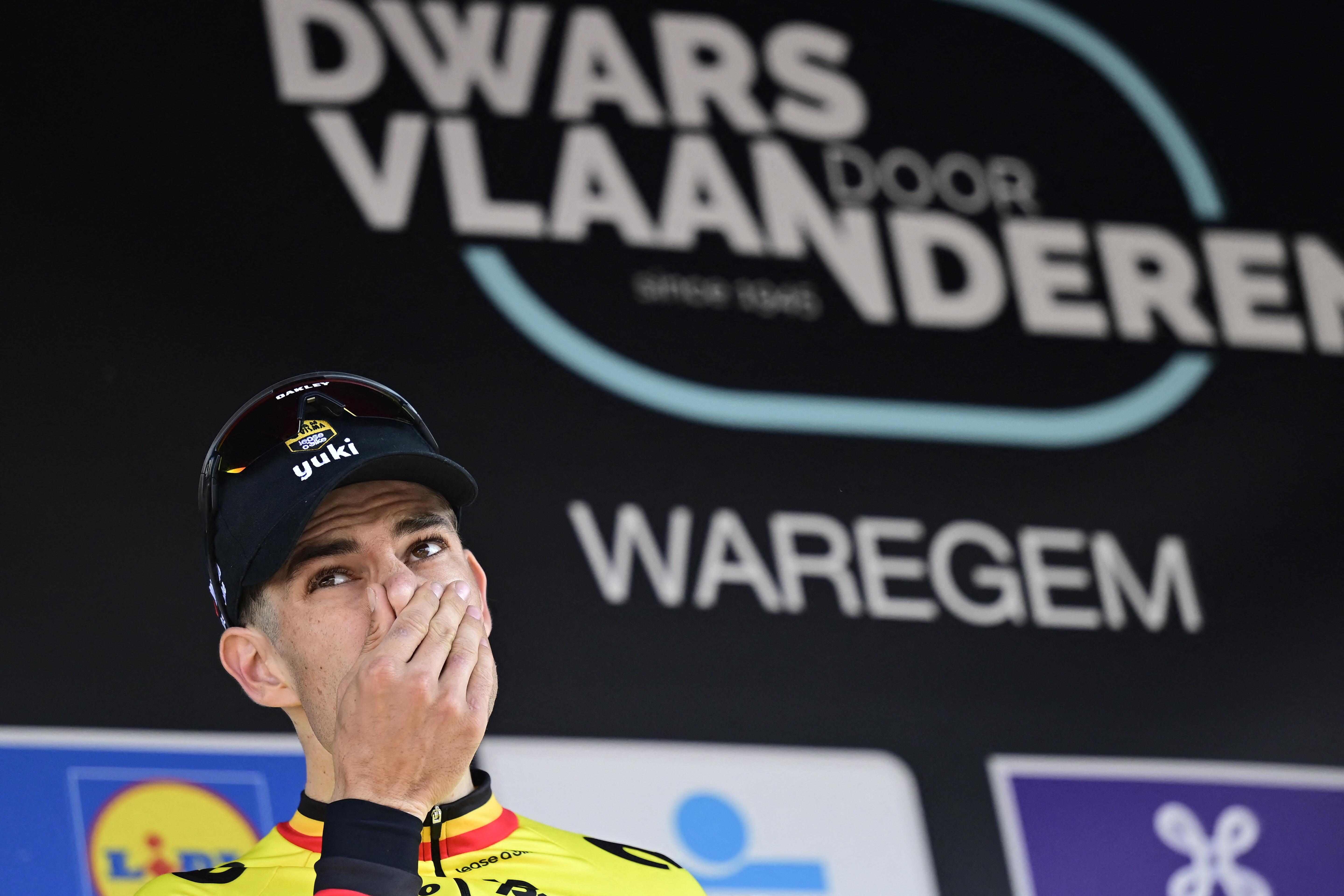 Team Visma-Lease a Bike's Bike rider Wout van Aert reacts on the stage of the elite men's race 'Dwars Door Vlaanderen', 184.2 km from Roeselare to Waregem, on April 2, 2025. (Photo by DIRK WAEM / Belga / AFP) / Belgium