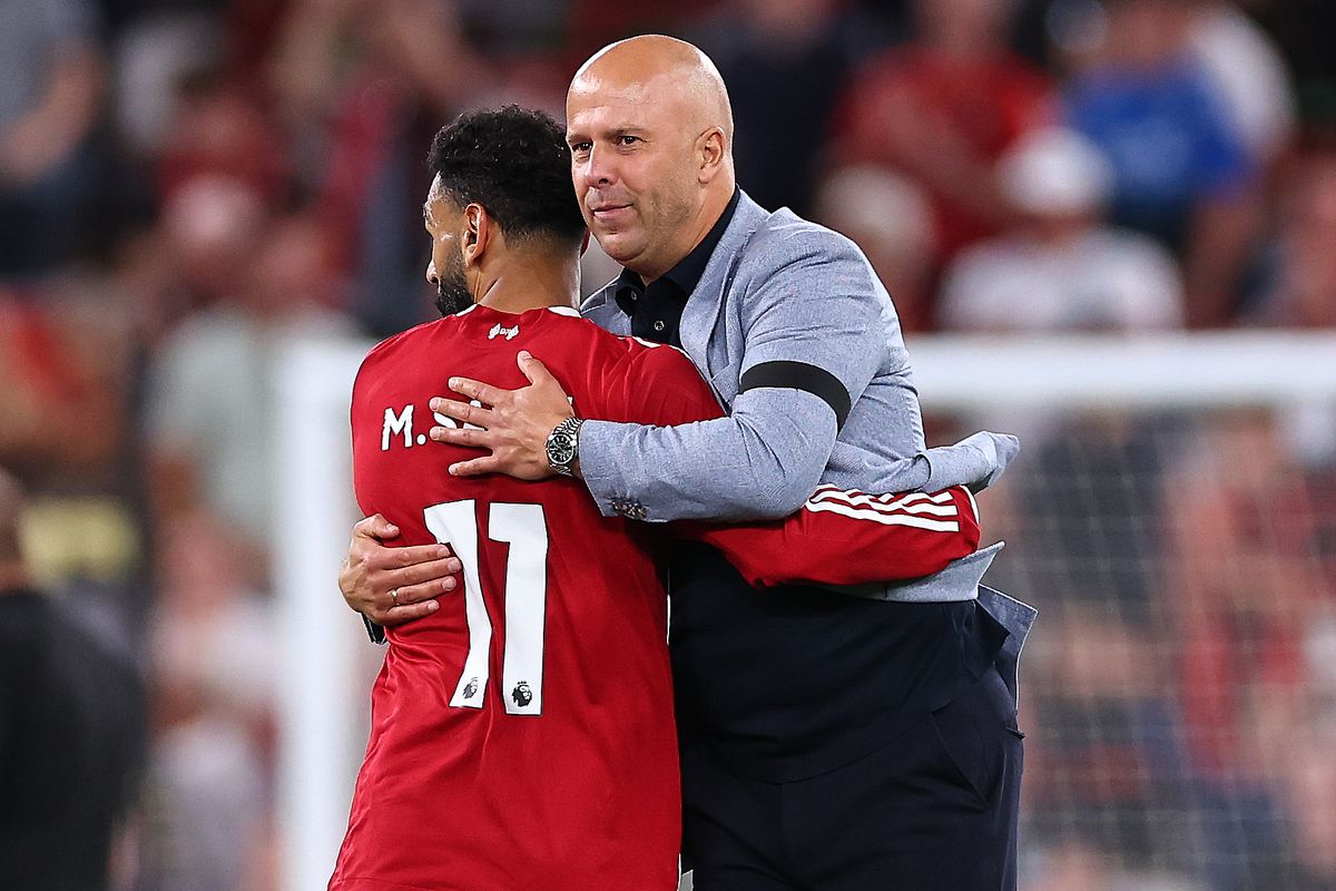 LIVERPOOL, ENGLAND - AUGUST 15: Arne Slot manager/head coach of Liverpool greets Mohamed Salah of Liverpool at full time during the Premier League match between Liverpool and Bournemouth at Anfield on August 15, 2025 in Liverpool, England. (Photo by Robbie Jay Barratt - AMA/Getty Images)