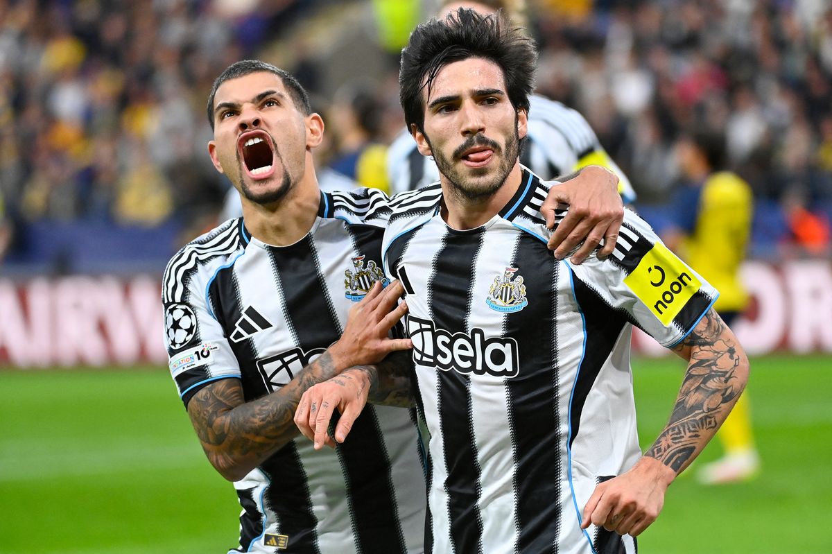 Newcastle United's Italian player #08 Sandro Tonali (R) celebrates scoring his team's first goal with Newcastle United's Brazilian player #39 Bruno Guimaraes during the UEFA Champions League, League One - Matchday 2 football match between Royale Union Saint-Gilloise and Newcastle United FC at RSC Anderlecht Stadium in Brussels on October 25, 20.