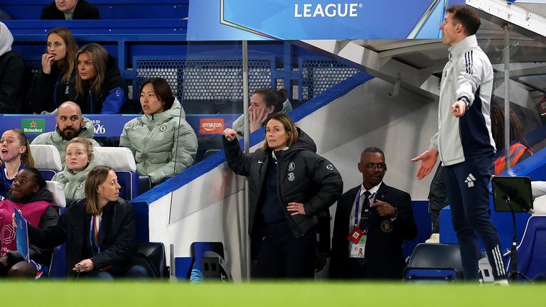 Sonia Bompastor is watching the quarter-finals of the Women's Champions League from the side of the tunnel.