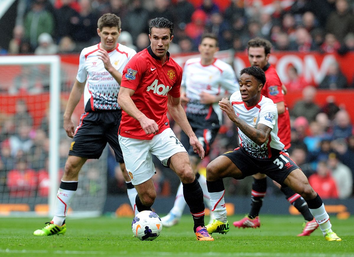Liverpool's Raheem Sterling vies with Manchester United's Robin Van Persie during the Barclays Premier Leauge match between Manchester United and Liverpool at Old Trafford.