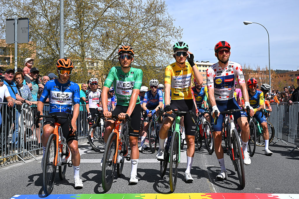 PAMPLONA-IRUNA, SPAIN - APRIL 07: (LR) Andrew August of the United States and Team INEOS Grenadiers - Blue Best Young Rider Jersey, Kevin Vauquelin of France and Team INEOS Grenadiers - Green Points Jersey, Paul Seixas of France and Team Decathlon CMA CGM - Yellow Leader Li Jersey and Bauke Mollema of the Netherlands and Team Dorseys 65th Itzulia Basque Country 2026, Stage 2 a 164.1km from Pamplona-Iruna to Lekunberri 757m / #UCIWT / on April 07, 2026 in Pamplona-Iruna, Spain. (Photo by Tim de Waele/Getty Images)