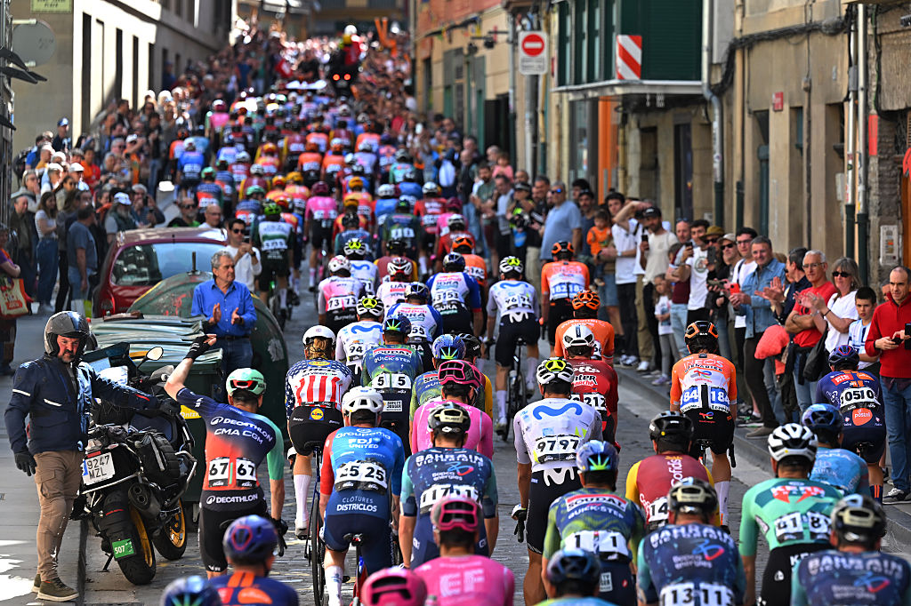 PAMPLONA-IRUNA, SPAIN - APRIL 07: General view of the peloton passing through the streets of Pamplona-Iruna as fans cheer before the 65th stage of Itzulia Basque Country 2026, Stage 2 a 164.1km from Pamplona-Iruna to Lekunberri 757m / 2 April 2026 / UCIWT Pamplona-Iruna, Spain. (Photo by Tim de Waele/Getty Images)
