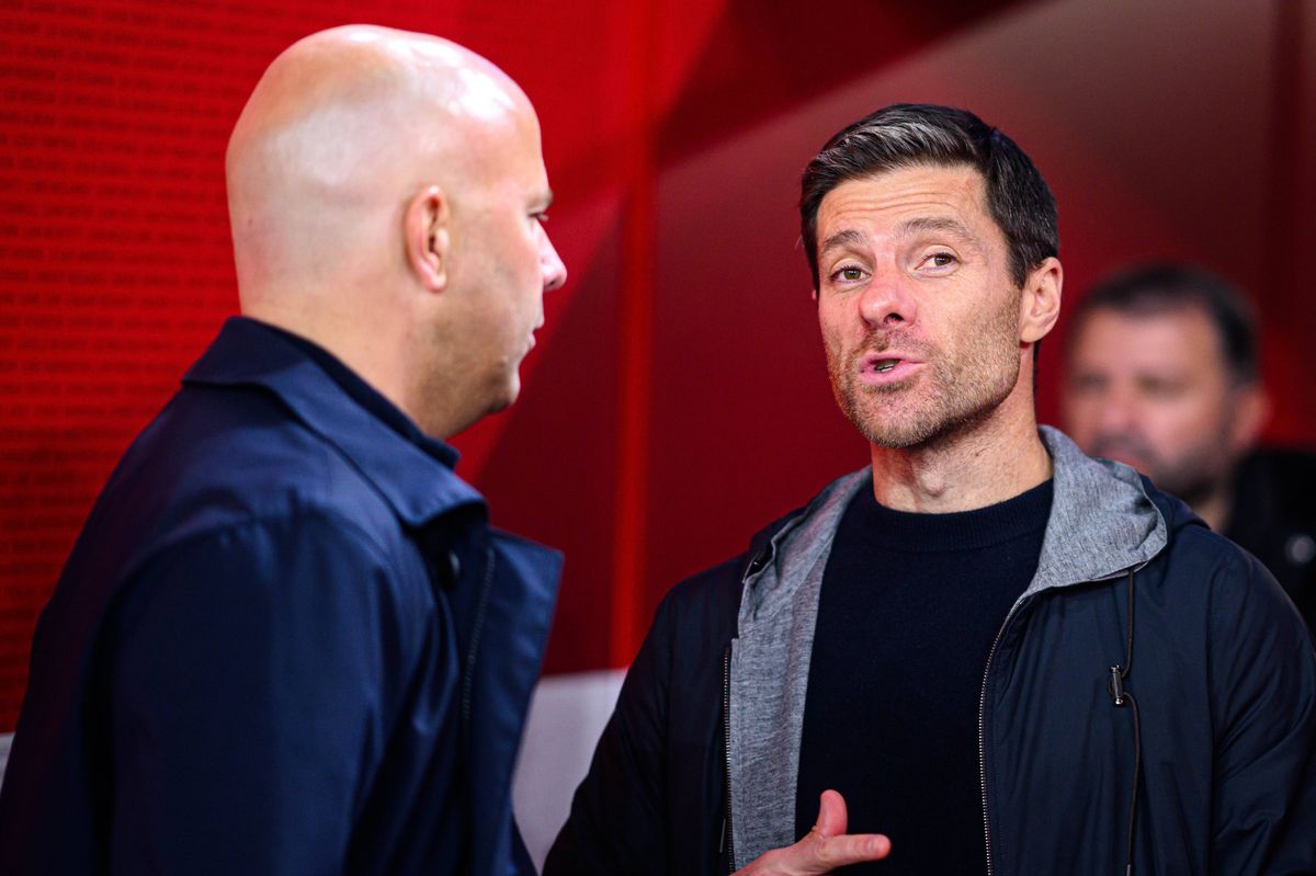 LIVERPOOL, ENGLAND - NOVEMBER 5: (LR) Arne Slot of Liverpool and coach Xabi Alonso of Leverkusen after the UEFA Champions League 2024/25 League Phase MD4 match between Liverpool FC and Bayer 04 Leverkusen at Anfield on November 5, 2024 in Liverpool, United Kingdom. (Photo by Jörg Schüler/Bayer 04 Leverkusen via Getty Images)