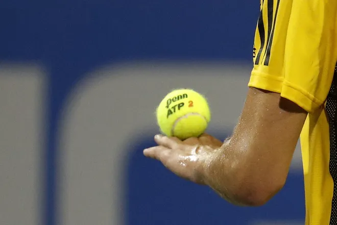 Aug 1, 2017; Washington, DC, USA; Austria's Dominic Thiem balances the ball in his hand before serving against Switzerland's Henri Laaksonen (not pictured) on day two of the Citi Open at the Fitzgerald Tennis Center. Thiem won 6-3, 6-3.