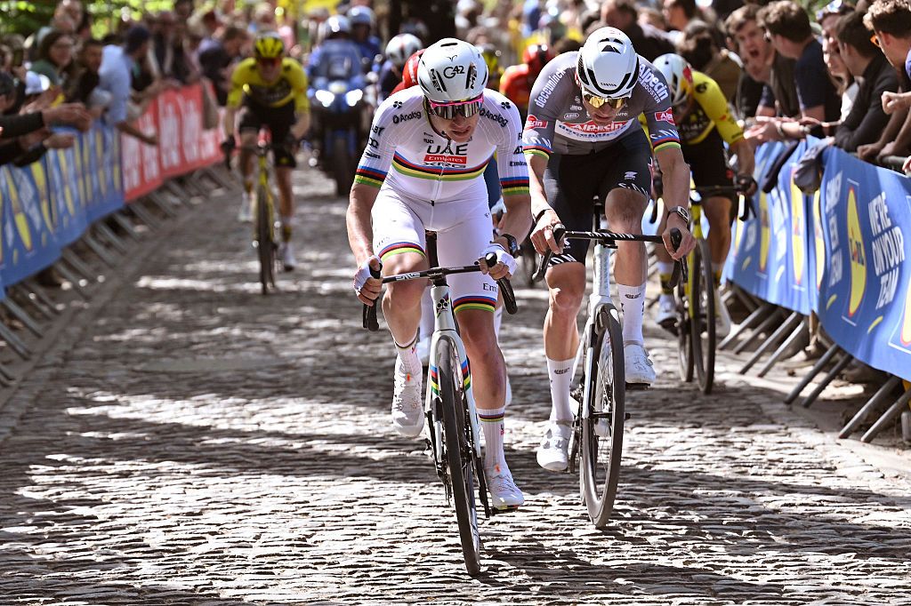 Tadej Pogacar climbs up cobbles